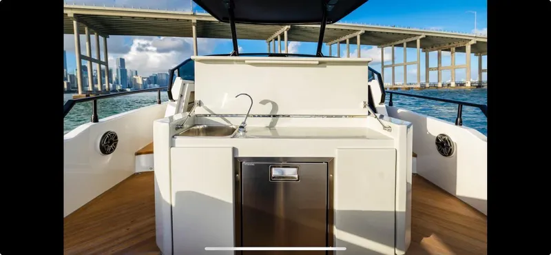  Yacht Photos Pics FIM 340 REGINA 2022 yacht with outdoor kitchen, bridge view, and ocean backdrop.