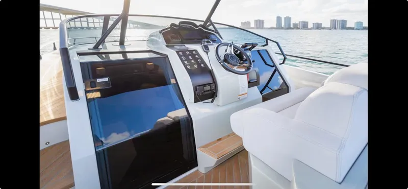  Yacht Photos Pics Luxury yacht cockpit of 2022 FIM 340 REGINA with modern controls and ocean view.