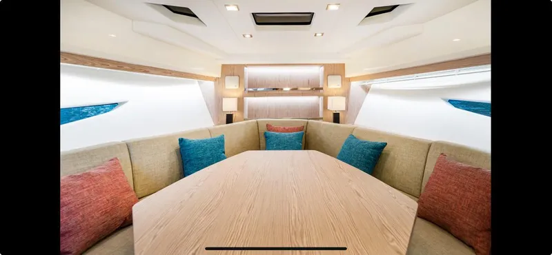  Yacht Photos Pics Luxurious interior of 2022 FIM 340 REGINA yacht with elegant seating and cushions.