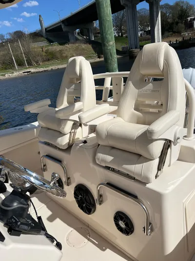 Next Level Yacht Photos Pics 2019 Grady-White Canyon 306 boat interior with luxurious seating and steering wheel.