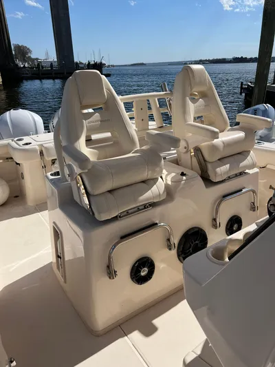 Next Level Yacht Photos Pics 2019 Grady-White Canyon 306 boat interior with luxurious seating and water view.