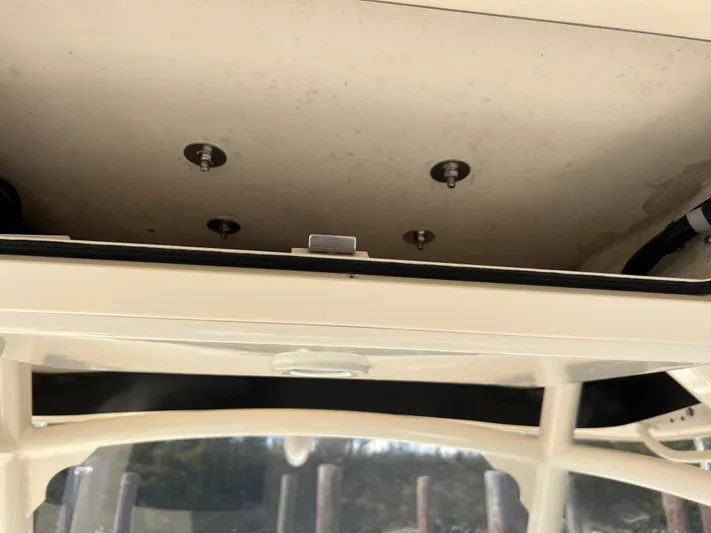 Next Level Yacht Photos Pics 2019 Grady-White Canyon 306 boat interior ceiling with visible bolts and wiring.
