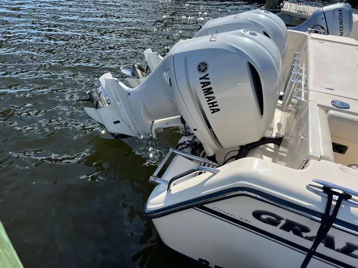 Next Level Yacht Photos Pics 2019 Grady-White Canyon 306 boat with Yamaha outboard engines on water.