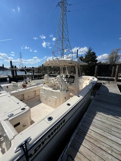 Next Level Yacht Photos Pics 2019 Grady-White Canyon 306 boat docked under clear blue sky.