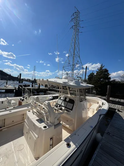 Next Level Yacht Photos Pics 2019 Grady-White Canyon 306 boat docked under clear blue sky.