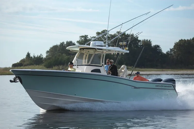 Next Level Yacht Photos Pics 2019 Grady-White Canyon 306 boat cruising on water with fishing rods.