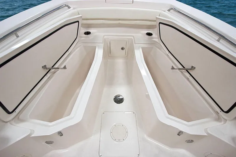 Next Level Yacht Photos Pics 2019 Grady-White Canyon 306 boat interior with open storage compartments.