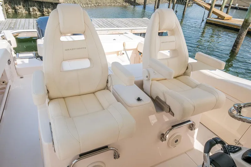 Next Level Yacht Photos Pics 2019 Grady-White Canyon 306 boat seats, luxurious white leather, dockside view.