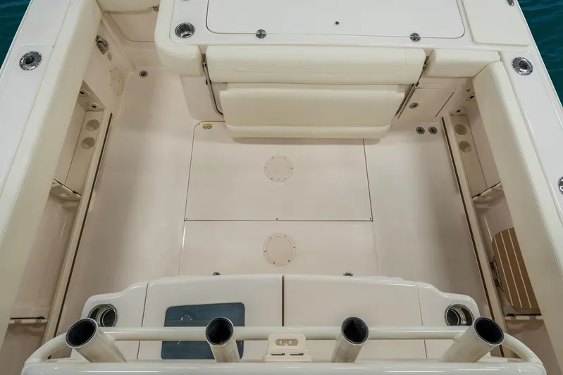 Next Level Yacht Photos Pics 2019 Grady-White Canyon 306 boat deck with rod holders and storage compartments.