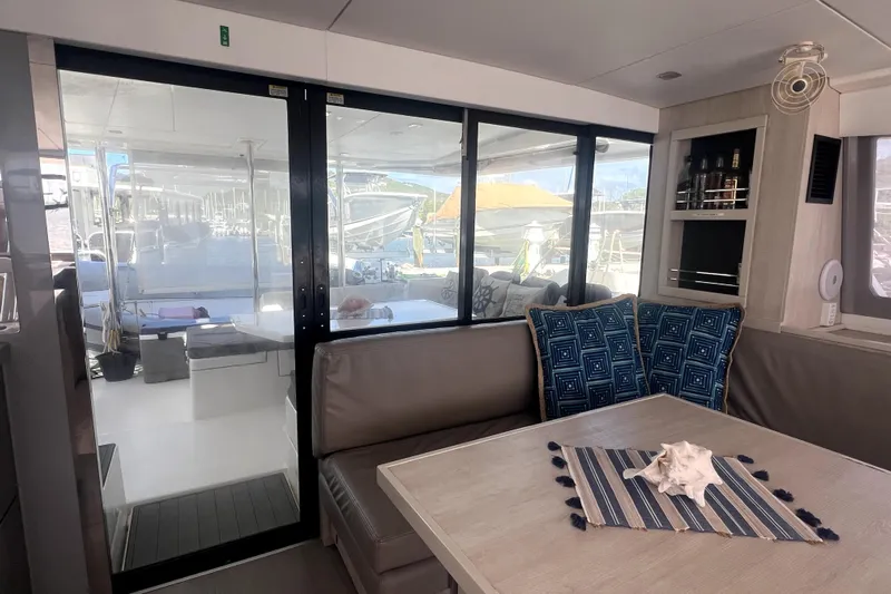  Yacht Photos Pics Interior of 2020 Leopard 43 Powercat with modern seating and decorative pillows.