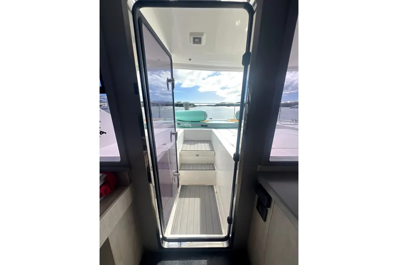  Yacht Photos Pics Interior view of 2020 Leopard 43 Powercat yacht, showcasing sleek design and outdoor access.