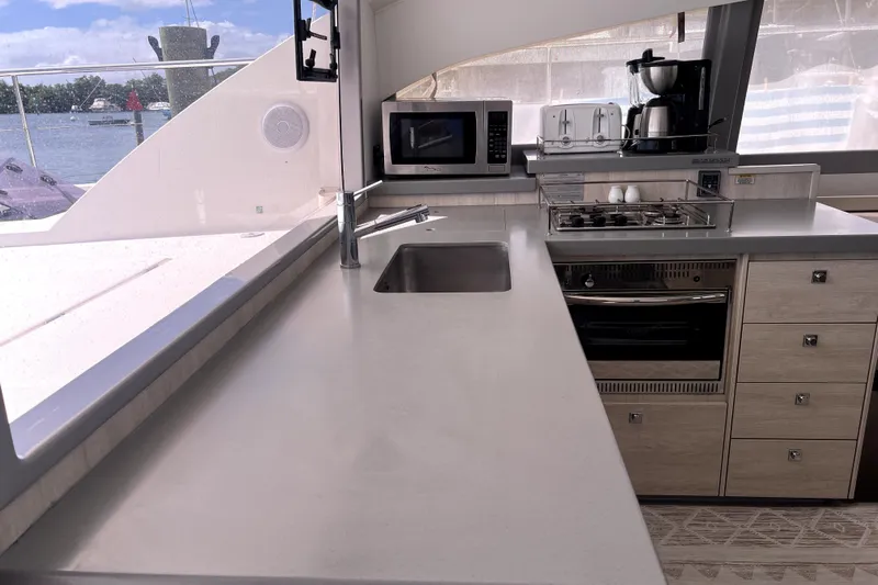  Yacht Photos Pics Modern kitchen interior on 2020 Leopard 43 Powercat yacht with appliances and ocean view.