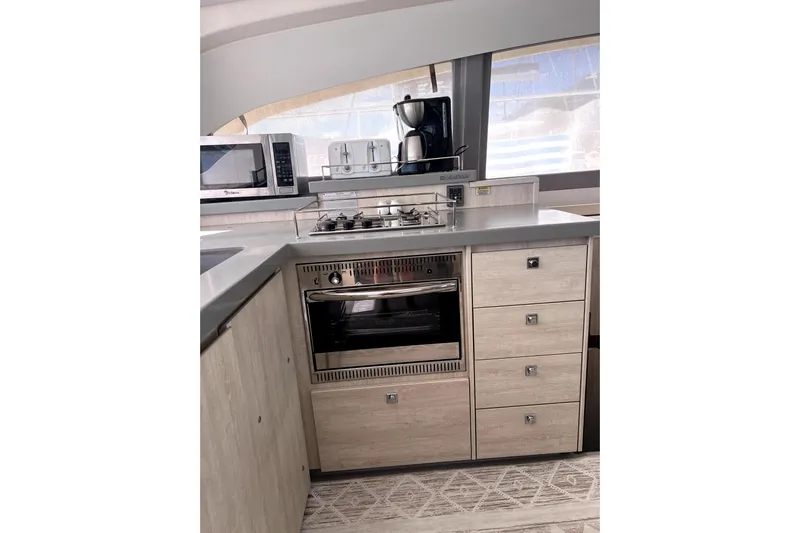  Yacht Photos Pics Modern kitchen interior of 2020 Leopard 43 Powercat yacht with appliances and cabinetry.