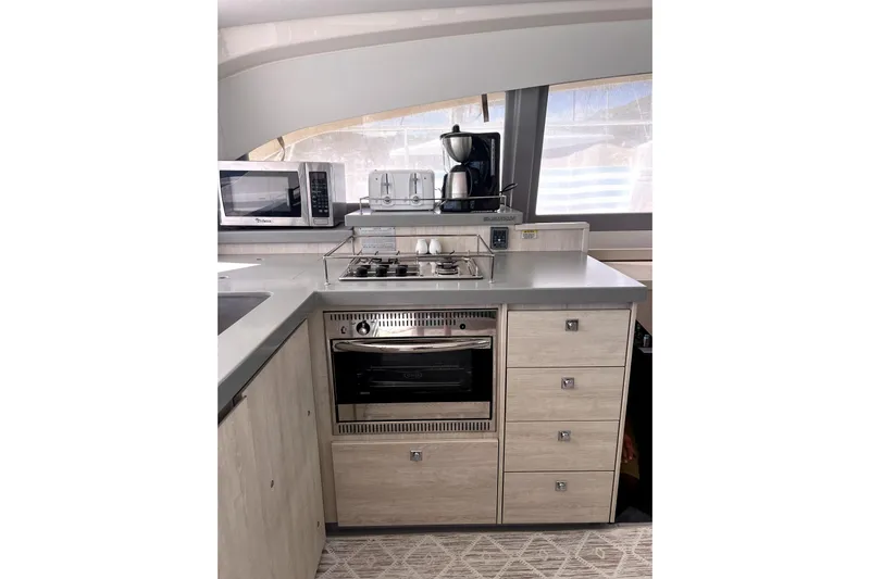  Yacht Photos Pics Modern kitchen in 2020 Leopard 43 Powercat with appliances and sleek cabinetry.