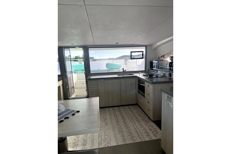  Yacht Photos Pics Modern kitchen interior of 2020 Leopard 43 Powercat yacht with ocean view.
