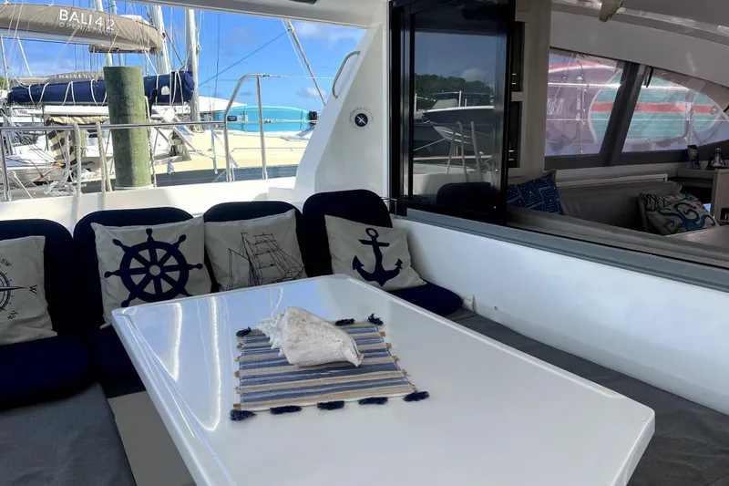  Yacht Photos Pics Leopard 43 Powercat 2020 yacht interior with nautical-themed cushions and table setting.