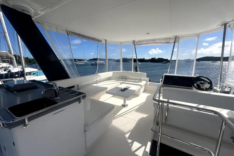  Yacht Photos Pics Luxurious 2020 Leopard 43 Powercat yacht interior with seating, helm, and ocean view.
