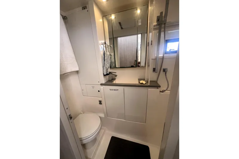 Yacht Photos Pics 2020 Leopard 43 Powercat bathroom with modern fixtures and mirror.