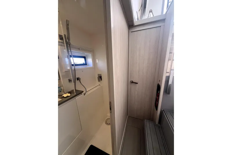  Yacht Photos Pics 2020 Leopard 43 Powercat interior bathroom with modern shower and sleek design.