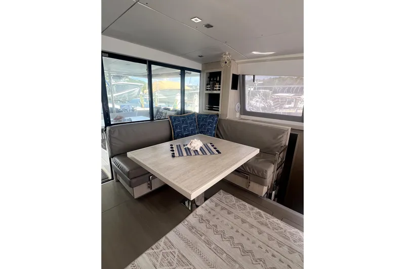  Yacht Photos Pics Interior of 2020 Leopard 43 Powercat with modern dining area and nautical decor.