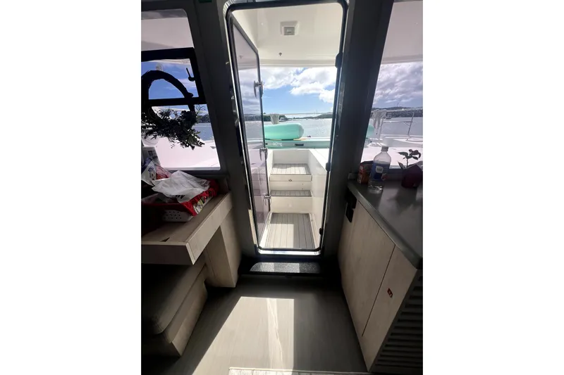  Yacht Photos Pics Interior view of 2020 Leopard 43 Powercat yacht with open door to deck.