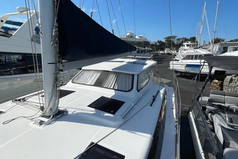  Yacht Photos Pics Sailboat docked at marina, Gemini Legacy 2013 model, surrounded by other boats.