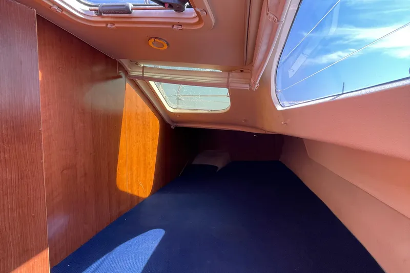  Yacht Photos Pics Interior cabin of 2013 Gemini Legacy boat with wooden paneling and skylight.