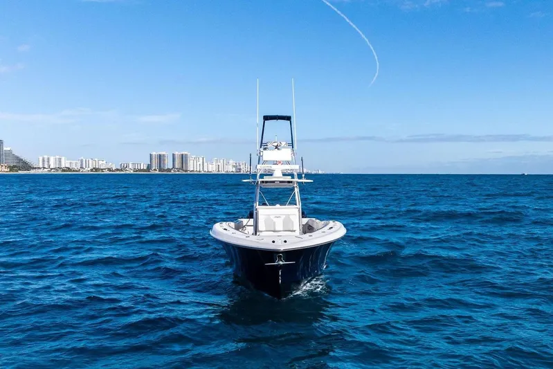  Yacht Photos Pics Invincible 42 Open Fisherman 2013 on open sea near city.