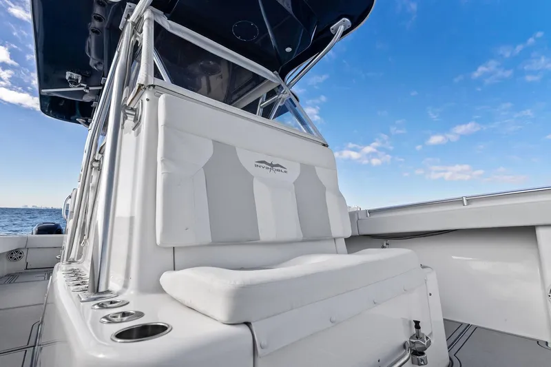  Yacht Photos Pics 2013 Invincible 42 Open Fisherman boat interior with seating, ocean view, and blue sky.
