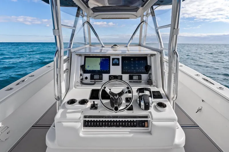  Yacht Photos Pics Cockpit view of 2013 Invincible 42 Open Fisherman boat on open sea.