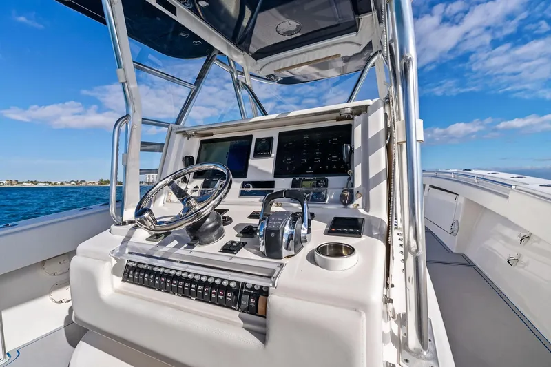  Yacht Photos Pics 2013 Invincible 42 Open Fisherman boat helm with modern controls and ocean view.