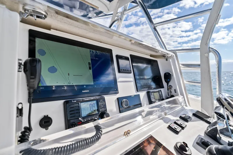  Yacht Photos Pics Control panel of 2013 Invincible 42 Open Fisherman with navigation and communication equipment.