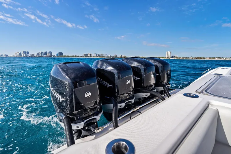  Yacht Photos Pics 2013 Invincible 42 Open Fisherman with four Mercury outboard engines on blue ocean.