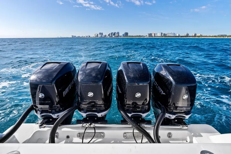  Yacht Photos Pics Four Mercury outboard engines on a 2013 Invincible 42 Open Fisherman boat, ocean view.