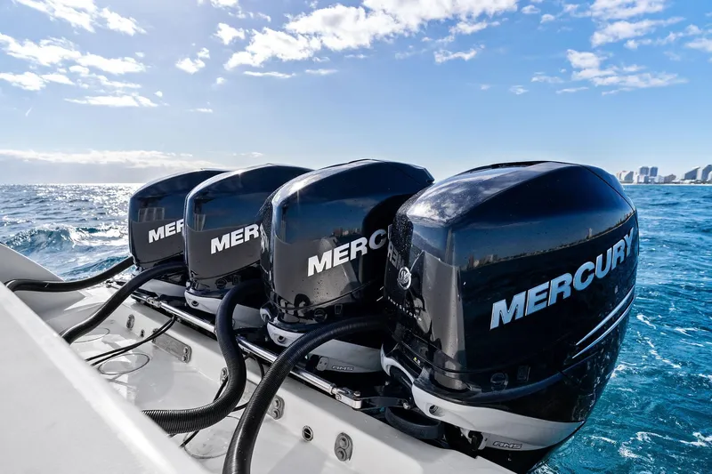  Yacht Photos Pics Four Mercury outboard engines on a 2013 Invincible 42 Open Fisherman boat at sea.