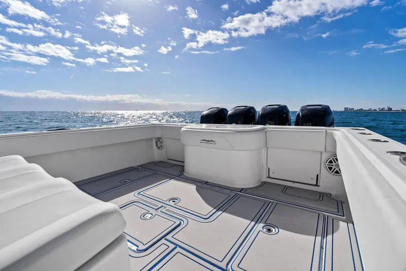  Yacht Photos Pics 2013 Invincible 42 Open Fisherman boat on open sea, clear sky, and calm waters.