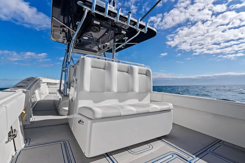  Yacht Photos Pics 2013 Invincible 42 Open Fisherman boat with white seating, ocean view, and blue sky.