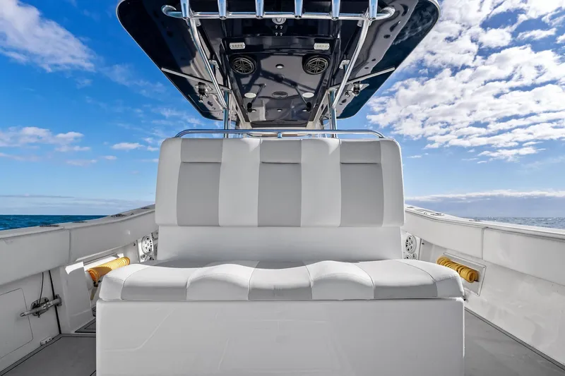  Yacht Photos Pics 2013 Invincible 42 Open Fisherman boat interior with white seating, ocean view, and blue sky.