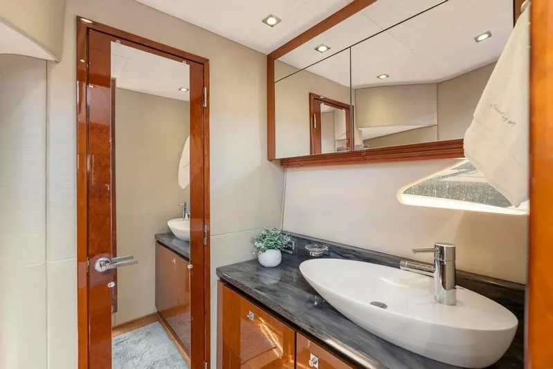  Yacht Photos Pics Luxurious bathroom interior of 2015 Sea Ray 510 Sundancer yacht with modern sink and mirror.