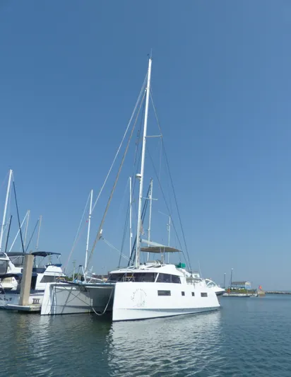Nauti By Nature Yacht Photos Pics 2017 Nautitech 46 Fly catamaran docked in a marina under clear blue skies.