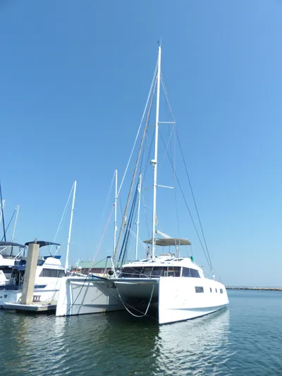 Nauti By Nature Yacht Photos Pics 2017 Nautitech 46 Fly catamaran docked in a marina under clear blue sky.