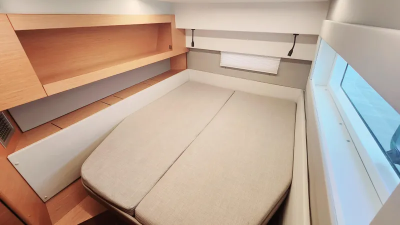 Nauti By Nature Yacht Photos Pics Cabin interior of 2017 Nautitech 46 Fly with bed and window view.