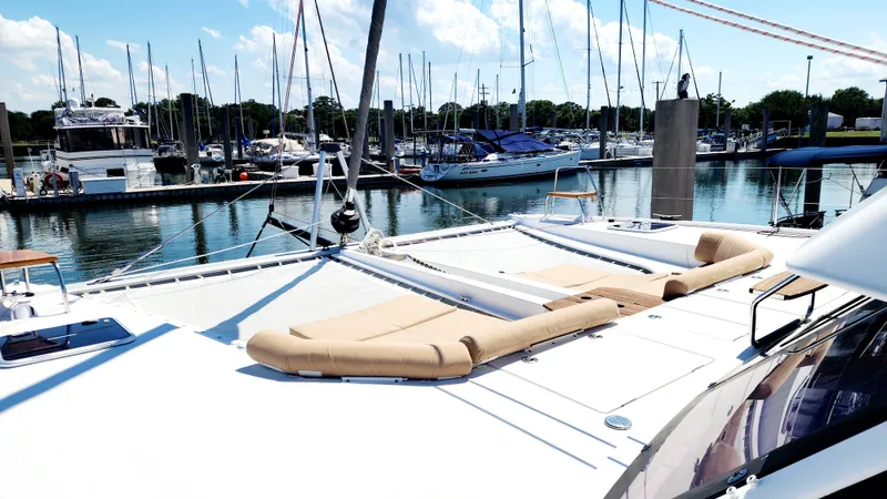 Nauti By Nature Yacht Photos Pics Nautitech 46 Fly 2017 catamaran with sun loungers docked at marina.