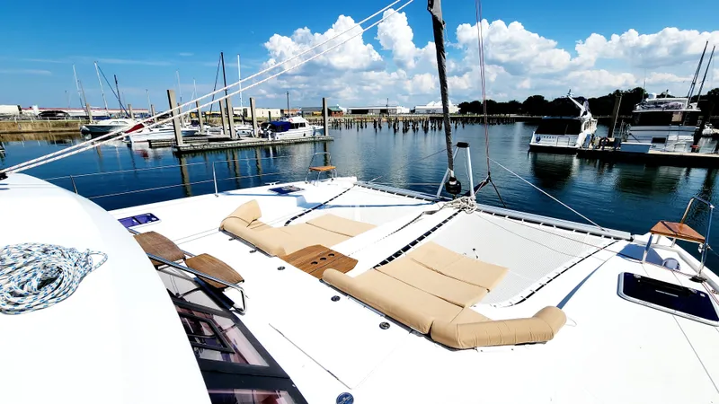 Nauti By Nature Yacht Photos Pics Luxurious Nautitech 46 Fly catamaran, 2017 model, docked at marina with clear blue skies.