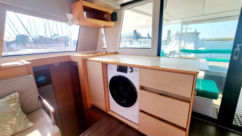 Nauti By Nature Yacht Photos Pics Interior of 2017 Nautitech 46 Fly yacht with washing machine and marina view.