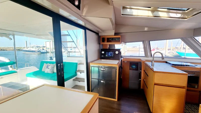 Nauti By Nature Yacht Photos Pics Interior of 2017 Nautitech 46 Fly catamaran with modern kitchen and outdoor seating.
