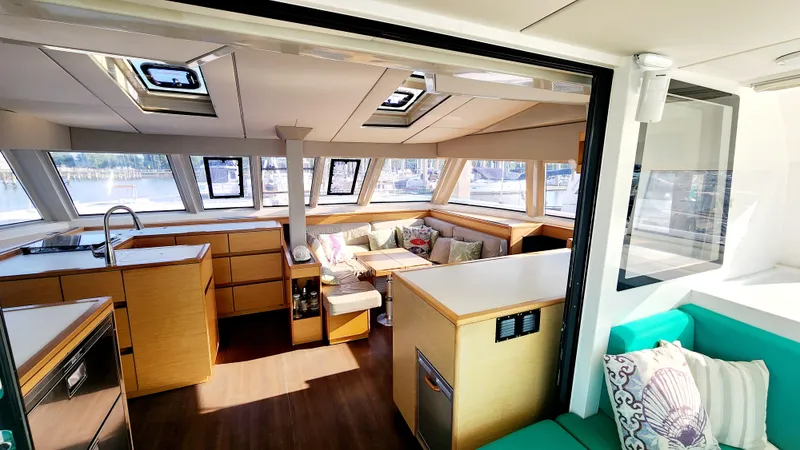 Nauti By Nature Yacht Photos Pics Luxurious interior of 2017 Nautitech 46 Fly catamaran with modern kitchen and cozy seating area.