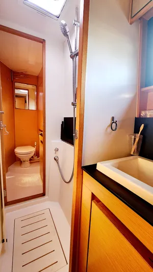 Nauti By Nature Yacht Photos Pics Bathroom interior of 2017 Nautitech 46 Fly yacht, featuring shower and sink.