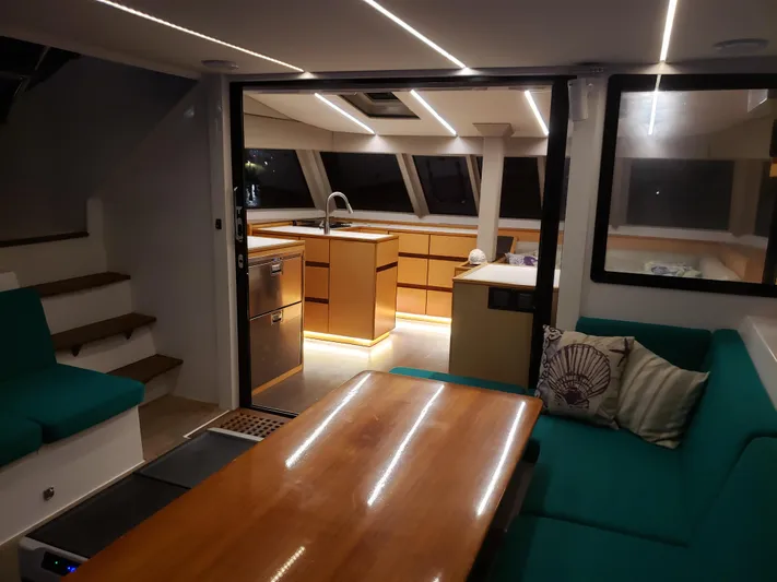 Nauti By Nature Yacht Photos Pics Luxurious interior of 2017 Nautitech 46 Fly catamaran with modern kitchen and seating area.