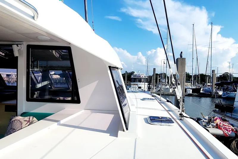 Nauti By Nature Yacht Photos Pics Nautitech 46 Fly 2017 catamaran docked at marina under clear blue sky.